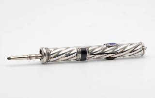 Victorian silver triple slider pencil by Sampson Mordan, the slider buttons set with black, blue and red enamel bands. The spiral cylindrical case stamped S Mordan & Co. c.1890. Photo Charles J Sharp CC BY-SA 4.0