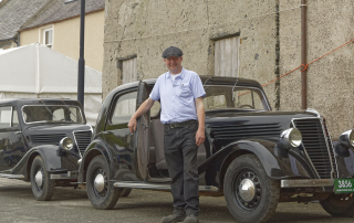 David Urquhart, chair of the Scottish Traditional Boat Festival committee with the 1938 Renault Primaquatre cars.